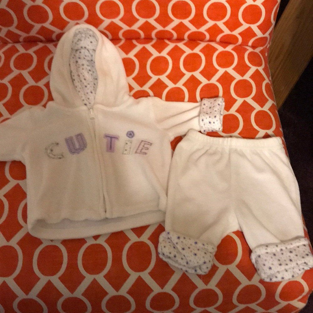 2 piece white soft white and purple outfit.